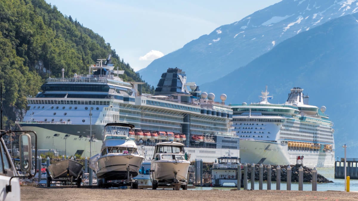 Cruise Ships Docked Next to Rocks in Skagway